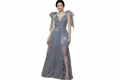 Carmen mother of the bride dress Woman wearing a sparkly blue evening gown with sheer sleeves on a white background