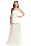 Gwen bridal maxi dress Woman wearing a strapless white dress with a plain background