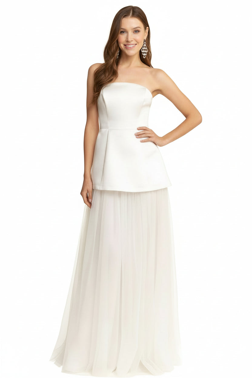 Gwen bridal maxi dress Woman wearing a strapless white dress with a plain background