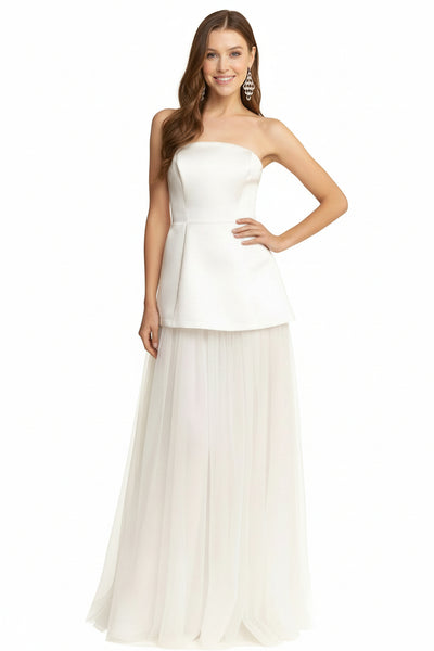 Gwen bridal maxi dress Woman wearing a strapless white dress with a plain background