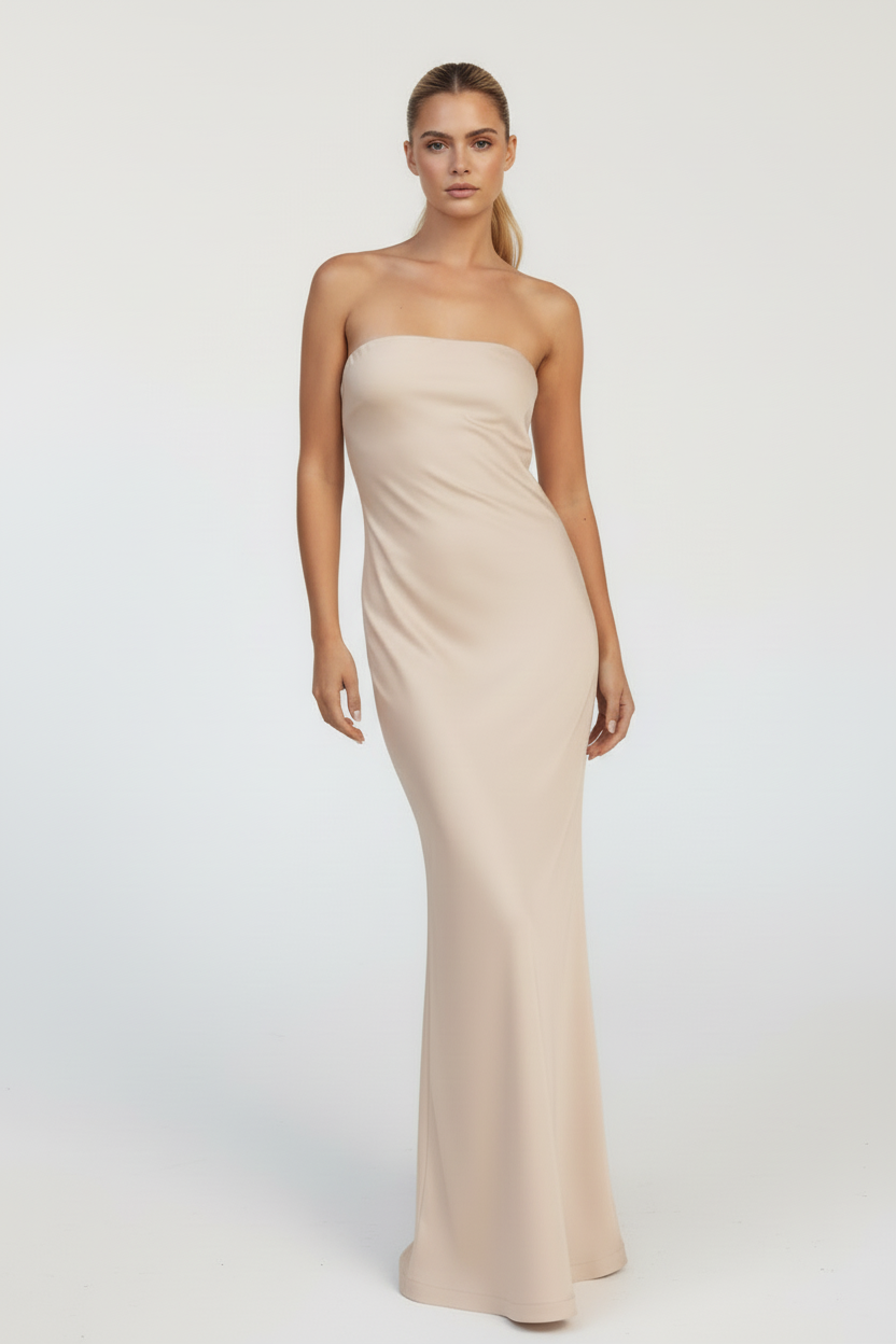 Mary bridal party dress Woman wearing a strapless beige gown on a white background