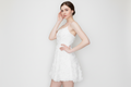 Pamela sophisticated bridal dress Woman wearing a white dress against a plain background