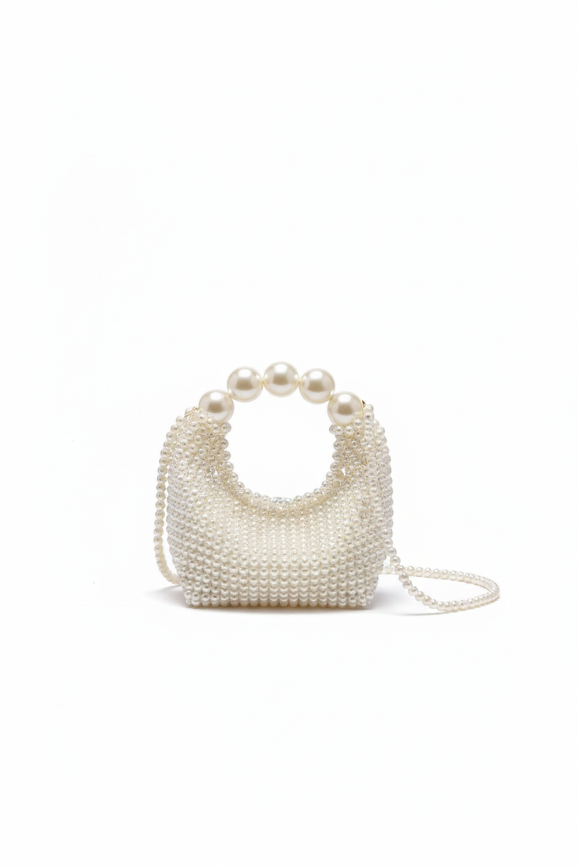 Pearl-handled handbag on a white background