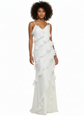 Woman wearing a white ruffled gown on a white background